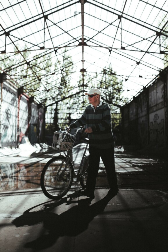 A man pushes his bike.